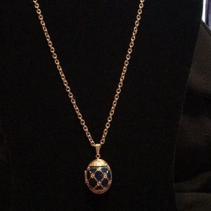 Adorable Egg shaped pendent with acrylic design.